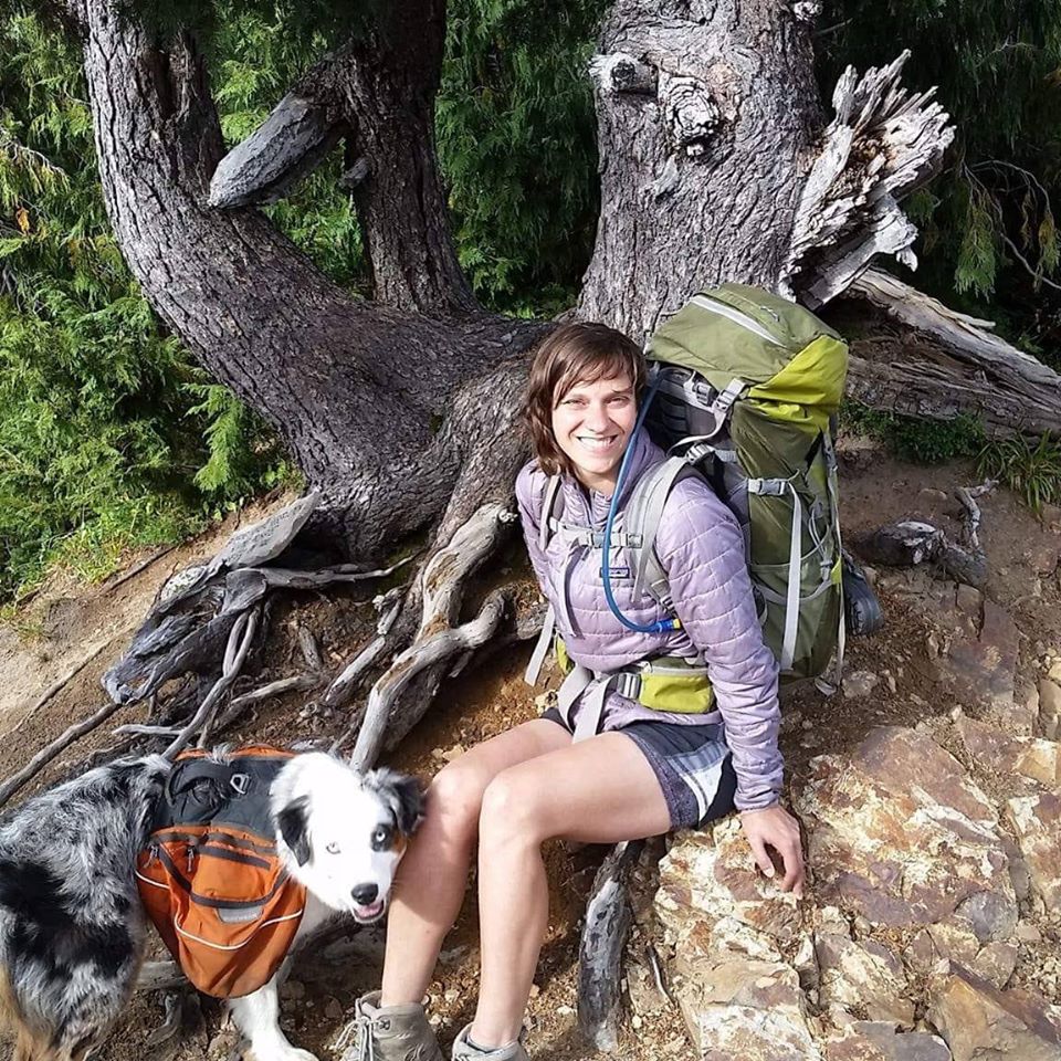 A photo of Megan and her dog hiking